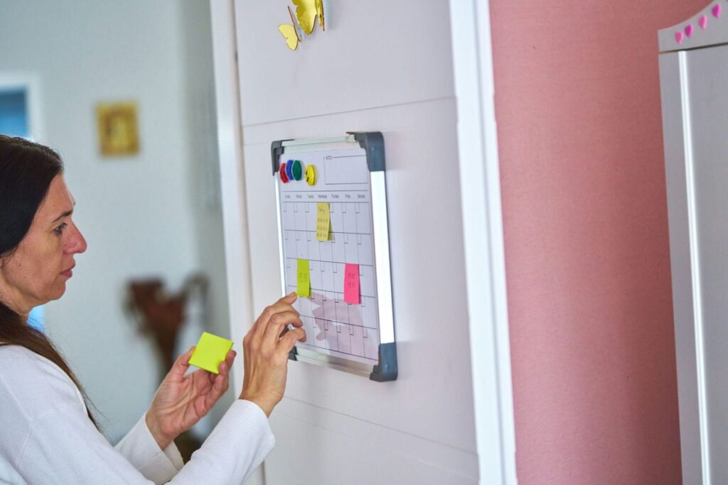 Wall calendar marked with key private school application dates representing a month-by-month timeline for fall entry